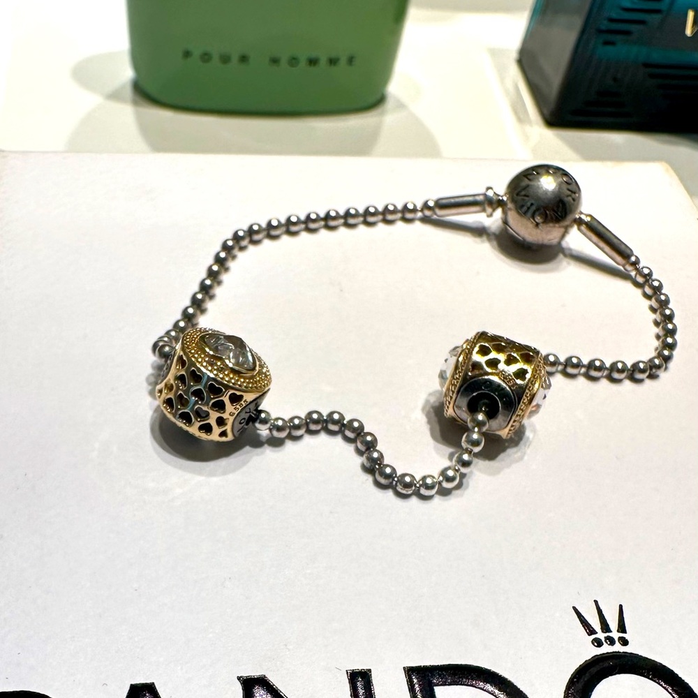 Pandora essence bracelet with two 14k heart charms.